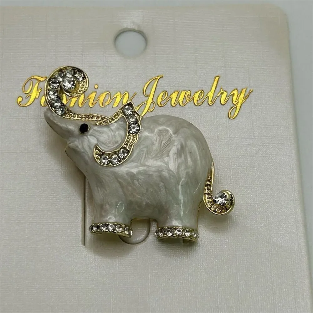 Small Dainty White Elephant Brooch Pin Rhinestone Accents Gold Tone Trunk Up